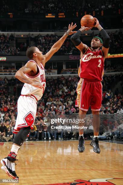 Mo Williams of the the Cleveland Cavaliers shoots a jump shot against Derrick Rose of the Chicago Bulls during the game at United Center on April 8,...