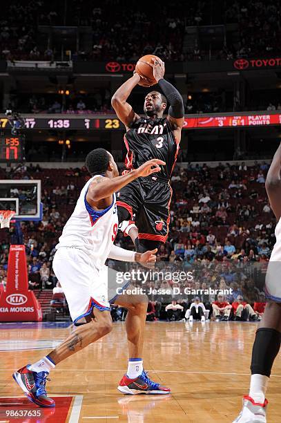 Dwyane Wade of the Miami Heat shoots a jumper against Andre Iguodala of the Philadelphia 76ers during the game at Wachovia Center on April 12, 2010...