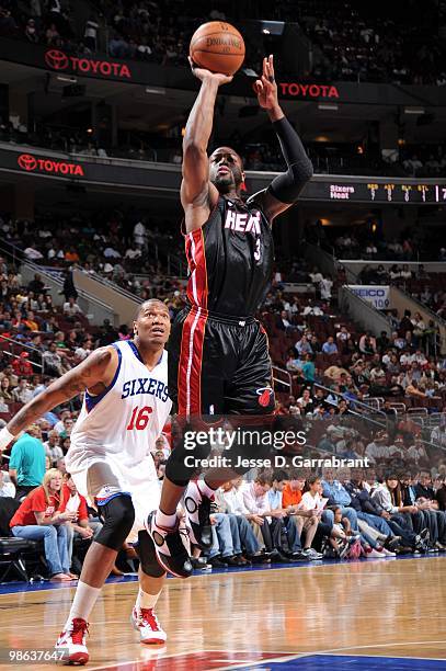 Dwyane Wade of the Miami Heat shoots a jumper against Marreese Speights of the Philadelphia 76ers during the game at Wachovia Center on April 12,...