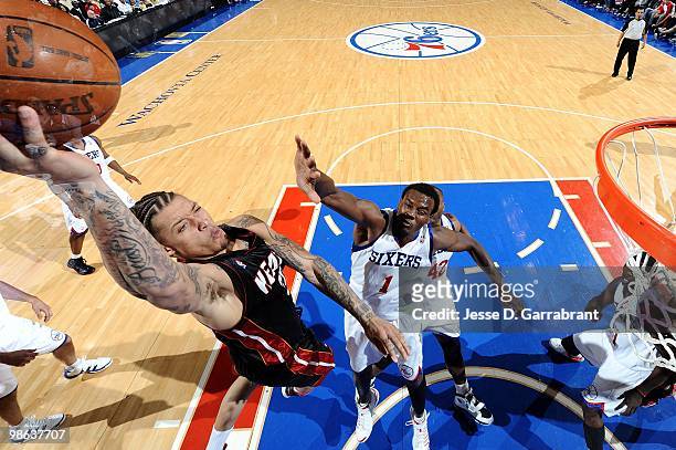Michael Beasley of the Miami Heat shoots a layup against Samuel Dalembert of the Philadelphia 76ers during the game at Wachovia Center on April 12,...