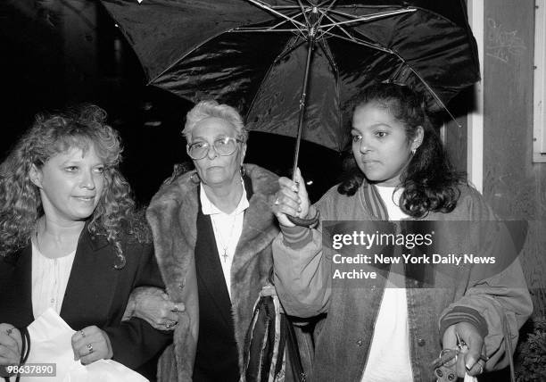 Maria Lugo , mother or victim, grandmother Bienvenida Wynns and aunt Berkis Cabbal, leaving court after defendant Enrique Rodriguez was convicted of...