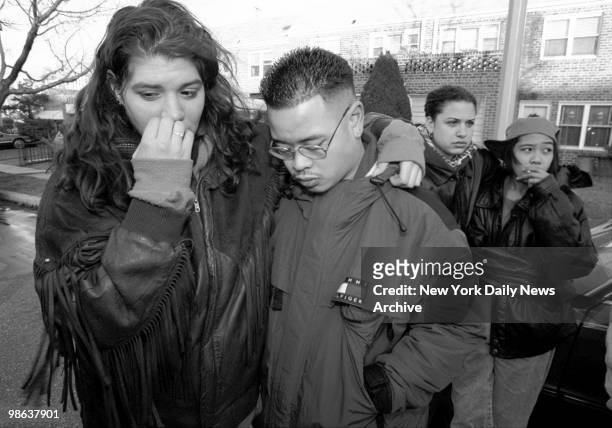 Friends of the victims mourn outside the Skyline Terrance Condominiums at 25-34 120th St., College Point, Queens. Six Colombian nationals were found...