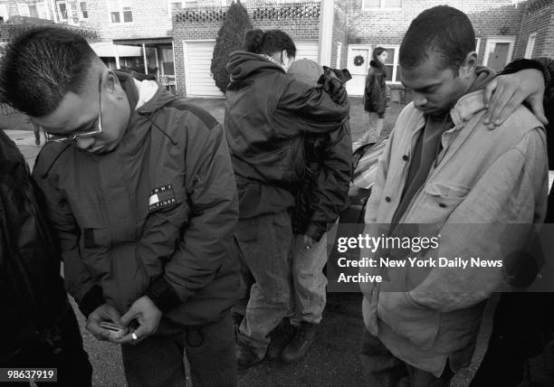 Friends of the victims mourn outside the Skyline Terrance Condominiums at 25-34 120th St., College Point, Queens. Six Colombian nationals were found...