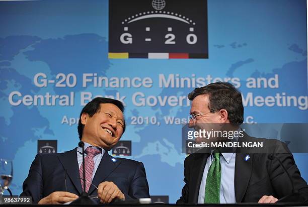 South Korea�s Finance Minister Yoon Jeung-hyun laughs with anadian Finance Minister Jim Flaherty during the IMF/World Bank Spring Meetings April 23,...