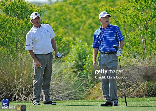 Jay Haas and Fred Couples watch a drive on during the first round round of the Legends Division at the Liberty Mutual Legends of Golf at The Westin...