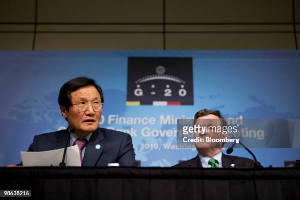 James Flaherty, Canada's finance minister, right, listens as Yoon Jeung-Hyun, South Korea's finance minister, speaks at a news conference during the...