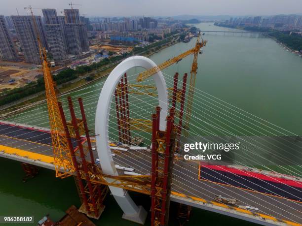 Aerial view of the construction site of Baisha Bridge on June 21, 2018 in Liuzhou, Guangxi Zhuang Autonomous Region of China. Baisha Bridge, the...