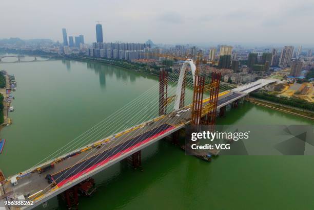 Aerial view of the construction site of Baisha Bridge on June 21, 2018 in Liuzhou, Guangxi Zhuang Autonomous Region of China. Baisha Bridge, the...