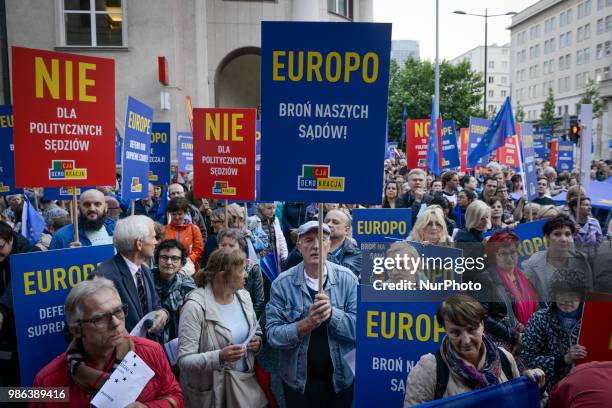 Protesters rally at the offices of the EU in Warsaw, Poland on June 25, 2018 against the upcoming court reforms. Forty percent of its Supreme Court...