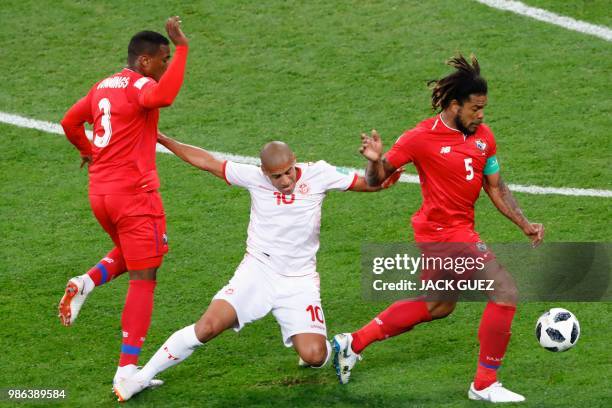 Tunisia's forward Wahbi Khazri fights for the ball with Panama's defender Harold Cummings and Panama's defender Roman Torres during the Russia 2018...