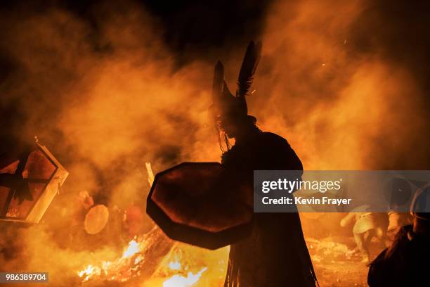 Mongolian Shamans or Buu, takes part in a fire ritual meant to summon spirits to mark the period of the Summer Solstice early June 24, 2018 outside...