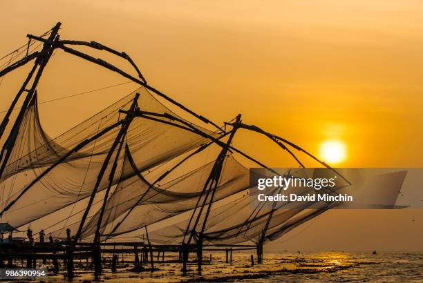 sunset fishing nets - david minchin stock-fotos und bilder