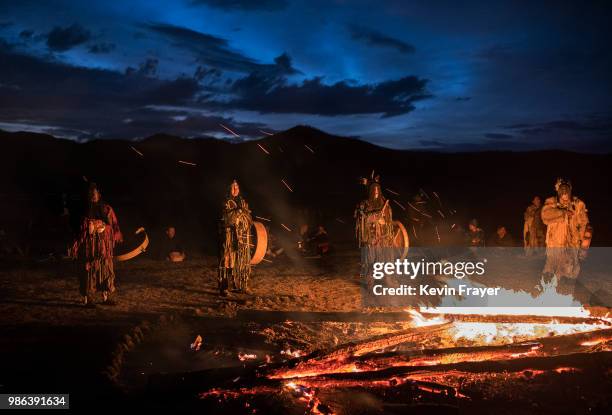 Mongolian Shamans or Buu, take part in a fire ritual meant to summon spirits to mark the period of the Summer Solstice in the grasslands on June 22,...