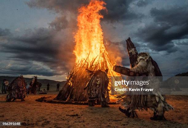 Mongolian Shamans or Buu, take part in a fire ritual meant to summon spirits to mark the period of the Summer Solstice in the grasslands on June 22,...