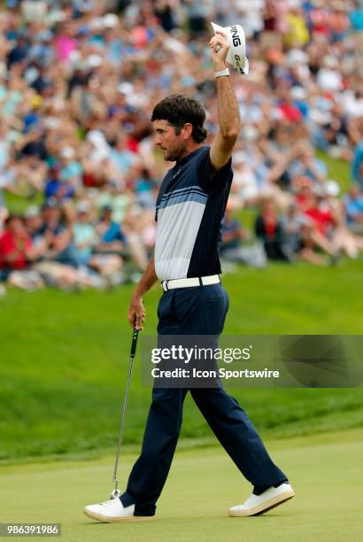 Bubba Watson of the United States waves his cap on the 18th =green during the Final Round of the Travelers Championship on June 24, 2018 at TPC River...