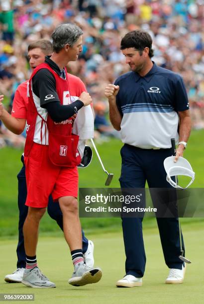 Bubba Watson of the United States fist bumps his caddie during the Final Round of the Travelers Championship on June 24, 2018 at TPC River Highlands...