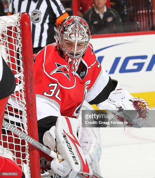 Cam Ward of the Carolina Hurricanes keeps his eye on the puck during a NHL game against the Montreal Canadiens on April 8, 2010 at RBC Center in...