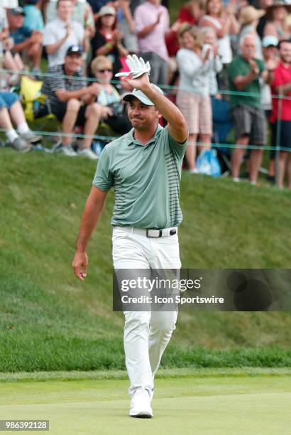 Jason Day of Australia waves to the gallery on 18 during the Final Round of the Travelers Championship on June 24, 2018 at TPC River Highlands in...