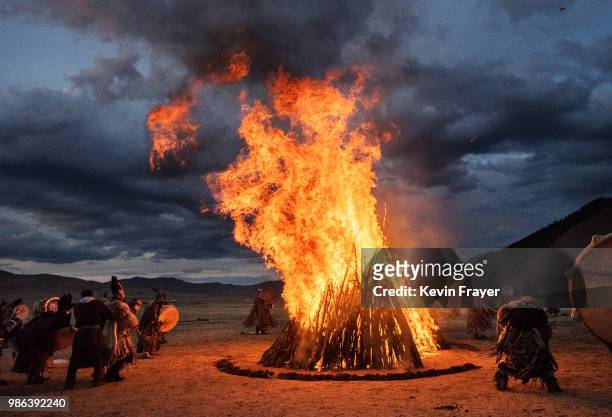 Mongolian Shamans or Buu, take part in a fire ritual meant to summon spirits to mark the period of the Summer Solstice in the grasslands on June 22,...