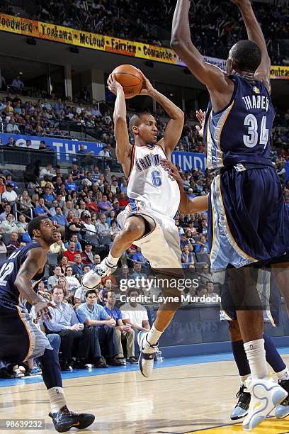 Eric Maynor of the Oklahoma City Thunder looks to pass against Hasheem Thabeet of the Memphis Grizzlies during the game at Ford Center on April 14,...