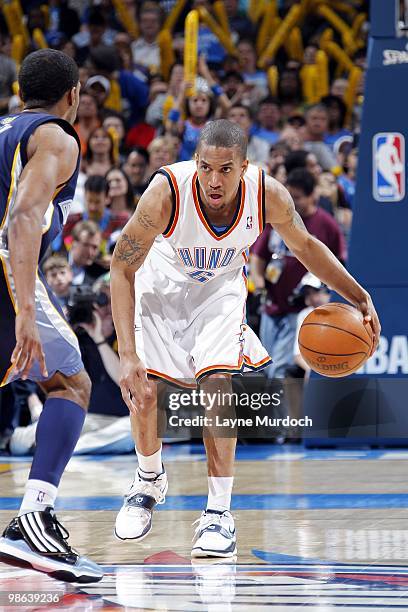 Eric Maynor of the Oklahoma City Thunder looks to make a move against Mike Conley of the Memphis Grizzlies during the game at Ford Center on April...