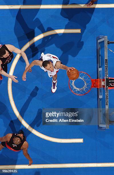 Tayshaun Prince of the Detroit Pistons dunks against Hedo Turkoglu and Jarrett Jack of the Toronto Raptors during the game at the Palace of Auburn...