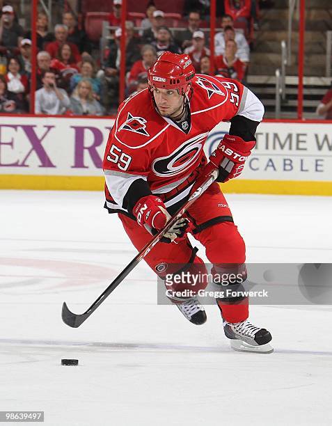 Chad LaRose of the Carolina Hurricanes skates with the puck during a NHL game against the Montreal Canadiens on April 8, 2010 at RBC Center in...