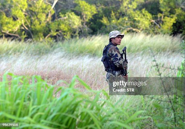 Police search for left-wing guerrillas in the bushes of the department of Concepcion, Paraguay, April 23, 2010. The Paraguayan government decreed a...