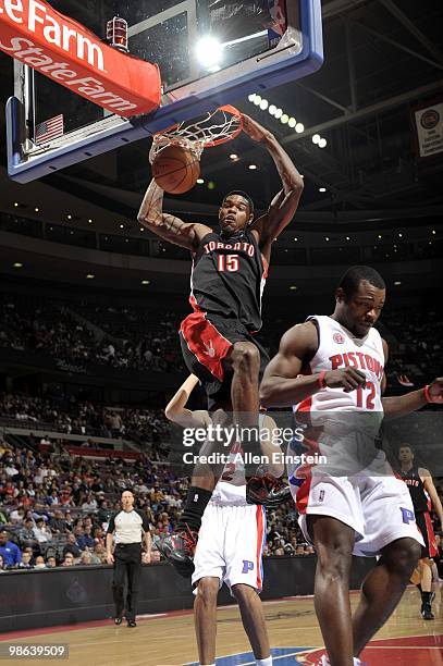 Amir Johnson of the Toronto Raptors dunks against Will Bynum of the Detroit Pistons during the game at the Palace of Auburn Hills on April 12, 2010...