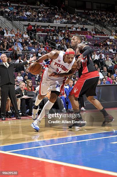 Charlie Villanueva of the Detroit Pistons drives to the basket against Sonny Weems of the Toronto Raptors during the game at the Palace of Auburn...