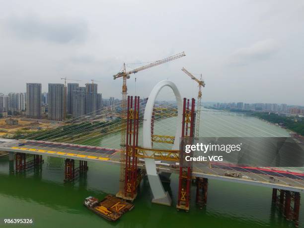 Aerial view of the construction site of Baisha Bridge on June 21, 2018 in Liuzhou, Guangxi Zhuang Autonomous Region of China. Baisha Bridge, the...