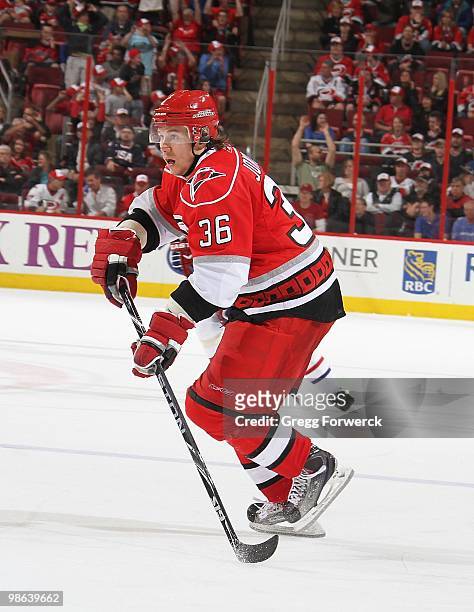 Jussi Jokinen of the Carolina Hurricanes passes the puck during a NHL game against the Montreal Canadiens on April 8, 2010 at RBC Center in Raleigh,...