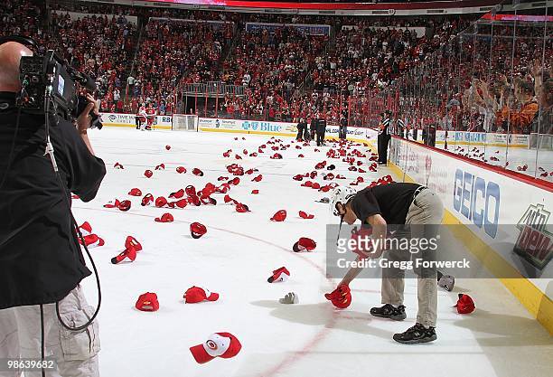 Eric Staal of the Carolina Hurricanes scores a hat trick goal on hat giveaway night that forced ice attendants to collect over 800 hats from the...