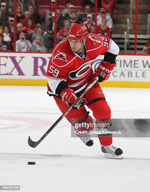 Chad LaRose of the Carolina Hurricanes skates with the puck during a NHL game against the Montreal Canadiens on April 8, 2010 at RBC Center in...