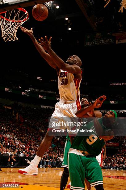 Joel Anthony of the Miami Heat shoots against Rajon Rondo of the Boston Celtics in Game Three of the Eastern Conference Quarterfinals during the 2010...