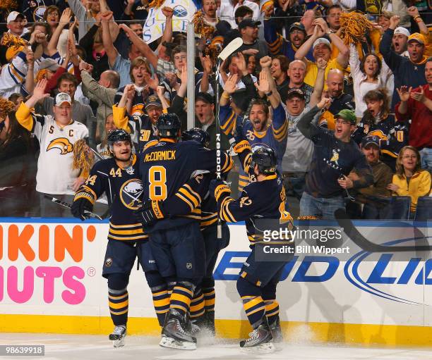 Adam Mair of the Buffalo Sabres celebrates his goal with teammates Andrej Sekera, Nathan Gerbe, and Cody McCormick during the first period against...