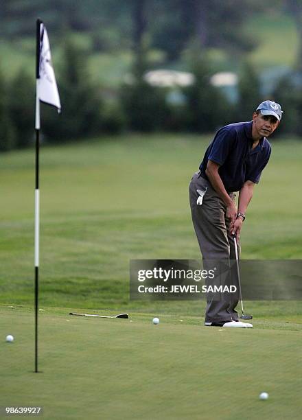 President Barack Obama plays golf at the Grove Park Inn in Asheville, North Carolina, on April 23, 2010. The First Couple arrived in Asheville on...