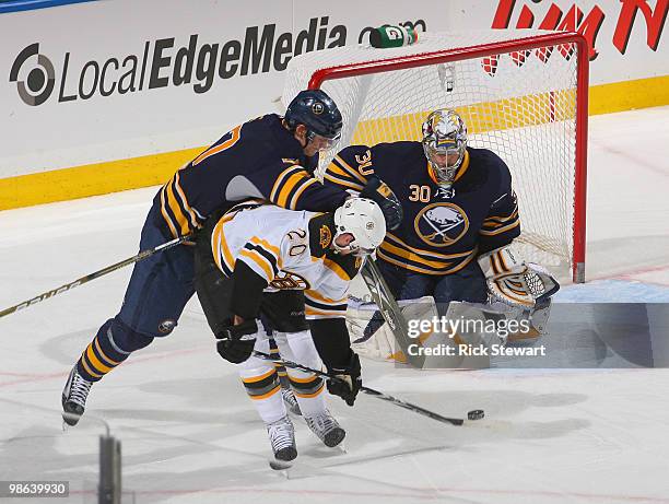 Daniel Paille of the Boston Bruins gets off a backhand shot that hits the post against Tyler Myers and Ryan Miller of the Buffalo Sabres in Game Five...