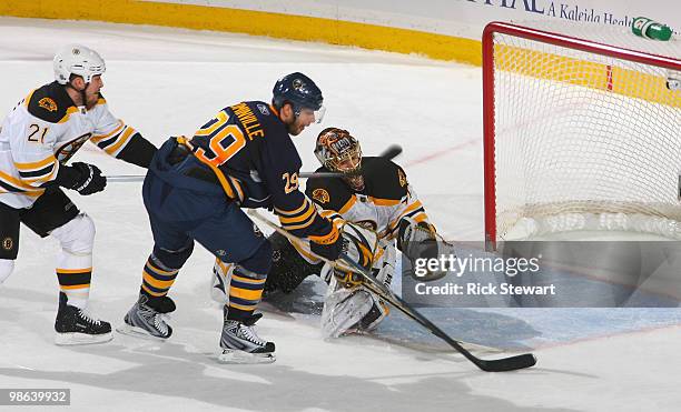 Jason Pominville of the Buffalo Sabres readies to score Buffalo's second goal in the first period against Andrew Ferrence and Tuukka Rask of the...