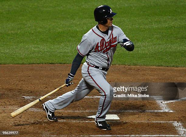 Chipper Jones of the Atlanta Braves hits an RBI single in the third inning against the New York Mets on April 23, 2010 at Citi Field in the Flushing...