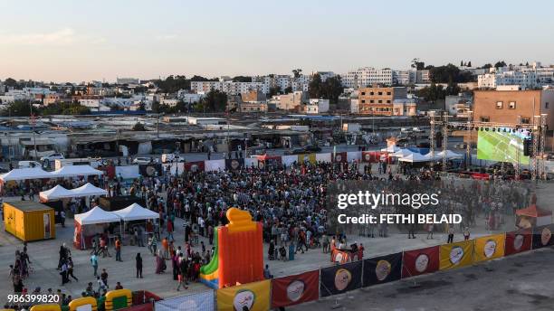 Tunisian football fans watch the Russia 2018 World Cup Group G match between Tunisia and Panama in the impoverished neighborhood of El-Mellassine in...