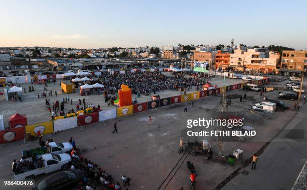 Tunisian football fans watch the Russia 2018 World Cup Group G match between Tunisia and Panama in the impoverished neighborhood of El-Mellassine in...