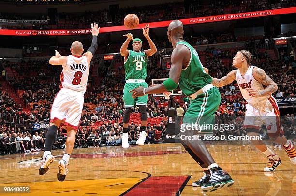 Rajon Rondo of the Boston Celtics passes against Carlos Arroyo of the Miami Heat in Game Three of the Eastern Conference Quarterfinals during the...