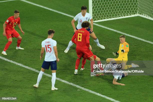 England goalkeeper Jordan Pickford slides off his line to stop a Belgian attack during the 2018 FIFA World Cup Russia Group G match between England...