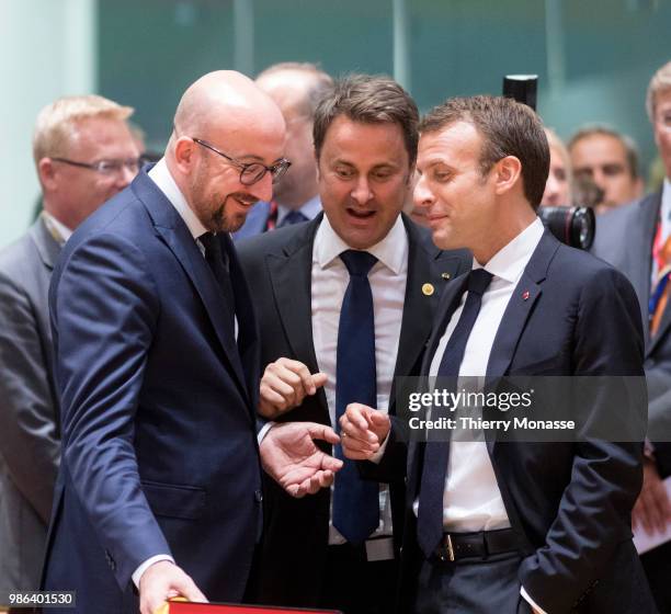 Belgium Prime Minister Charles Michel is talking with the Luxembourg Prime Minister Xavier Bettel and the French President Emmanuel Macron during an...