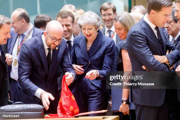 Belgium Prime Minister Charles Michel is giving a Belgium national football team of Eden Hazard to the Prime Minister of the United Kingdom Theresa...
