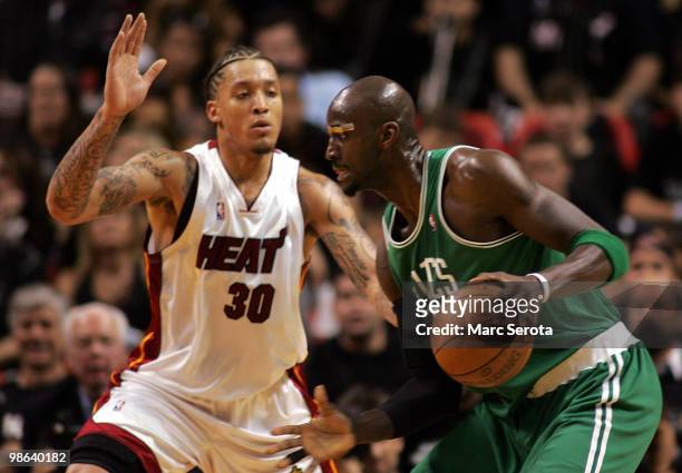 Forward Kevin Garnett of the Boston Celtics drives against forward Michael Beasley of the Miami Heat in Game Three of the Eastern Conference...