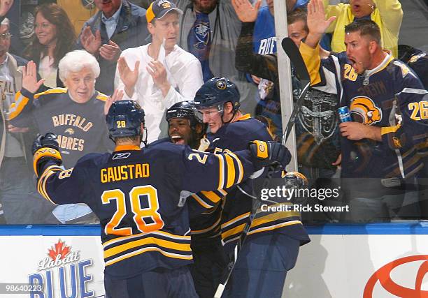 Paul Gaustad, Mike Grier and Tyler Myers of the Buffalo Sabres celebrate Grier's goal in the second period against the Boston Bruins in Game Five of...