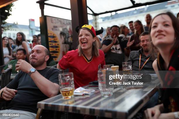 Football fans watch the World Cup match between England and Belgium in a bar on June 28, 2018 in Brussels, Belgium. Both England and Belgium are...