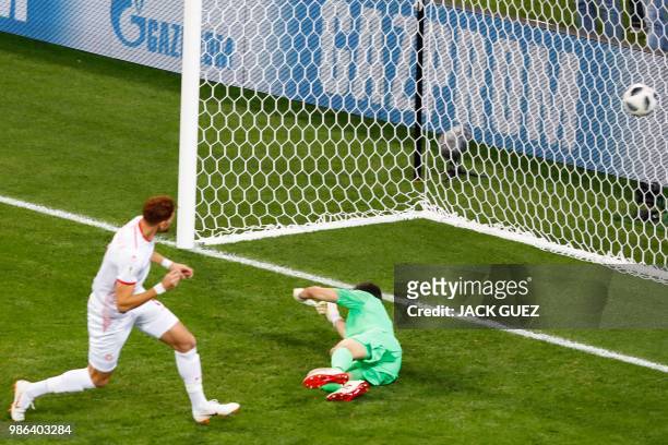Tunisia's forward Fakhreddine Ben Youssef scores against Panama's goalkeeper Jaime Penedo during the Russia 2018 World Cup Group G football match...